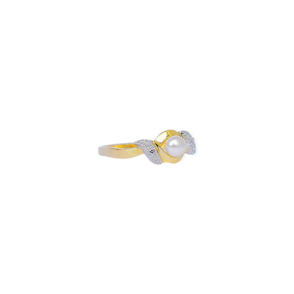 An elegant 18k gold bypass ring featuring a luminous central pearl, with sparkling textured details on each side.