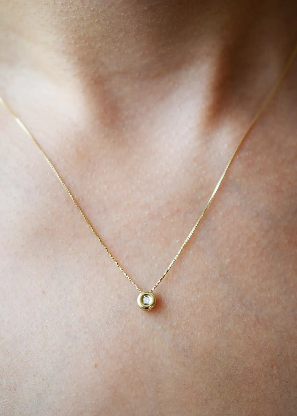 Delicate 18 Karat Yellow Gold Chain with a single, sparkling Brilliant-Cut Diamond Pendant.