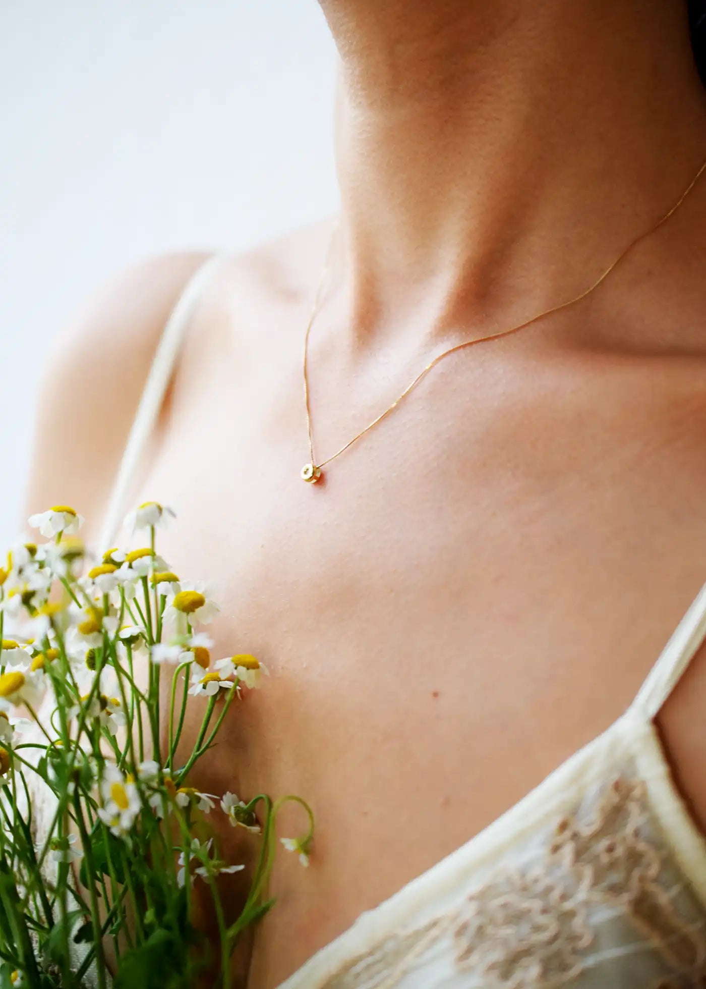 Delicate 18 Karat Yellow Gold Chain with a single, sparkling Brilliant-Cut Diamond Pendant.