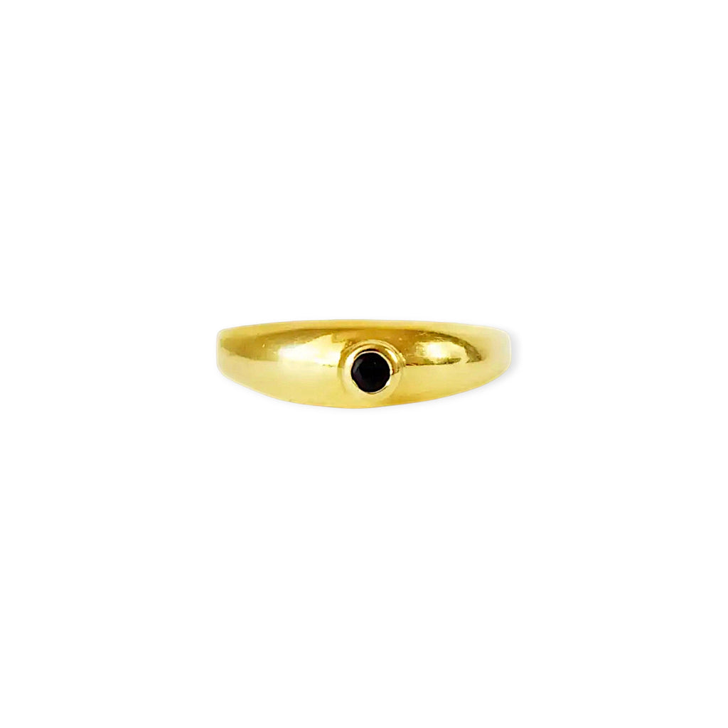 Elegant 18 Karat Yellow Gold vintage cigar band ring featuring a prominent round bezel-set blue sapphire.
