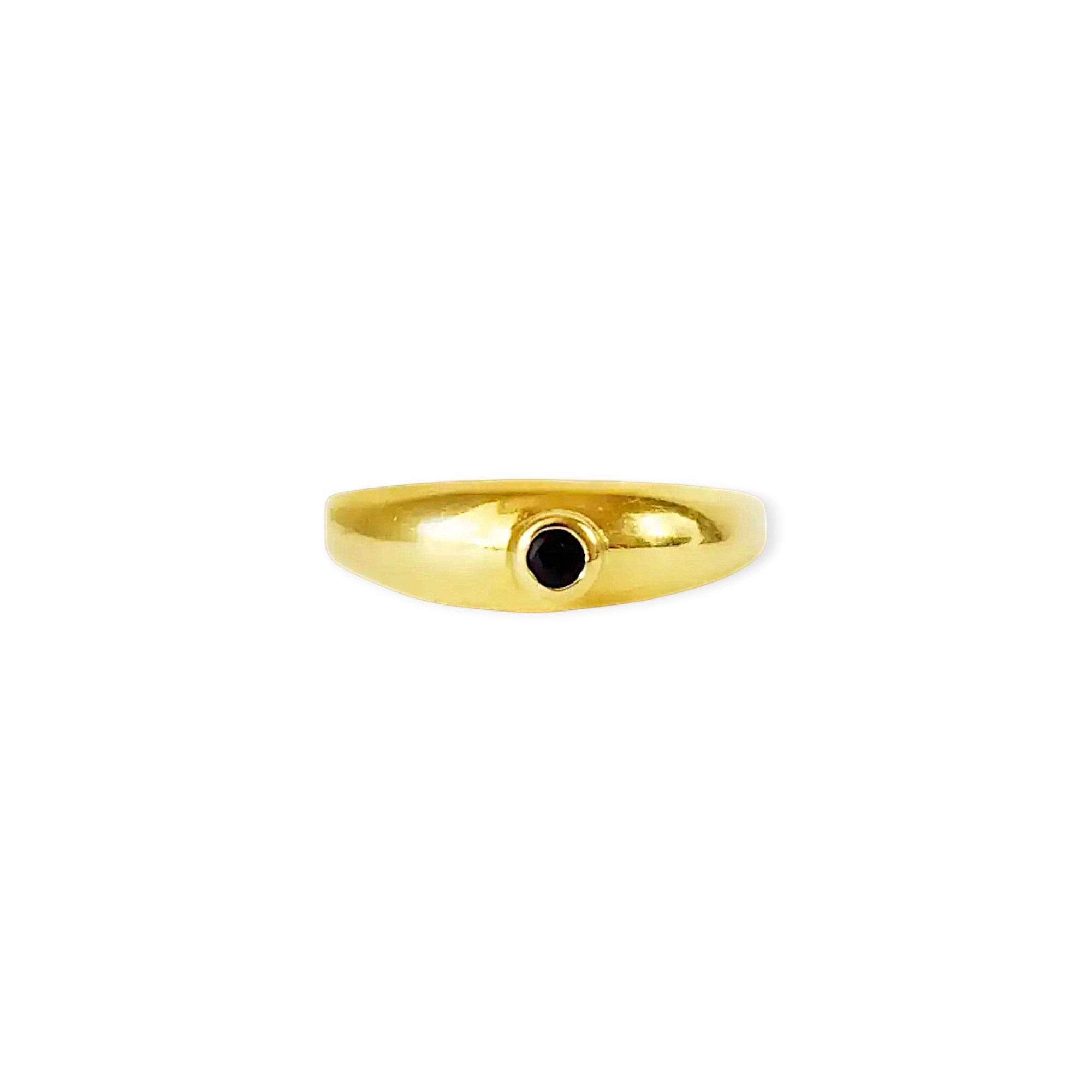 Elegant 18 Karat Yellow Gold vintage cigar band ring featuring a prominent round bezel-set blue sapphire.