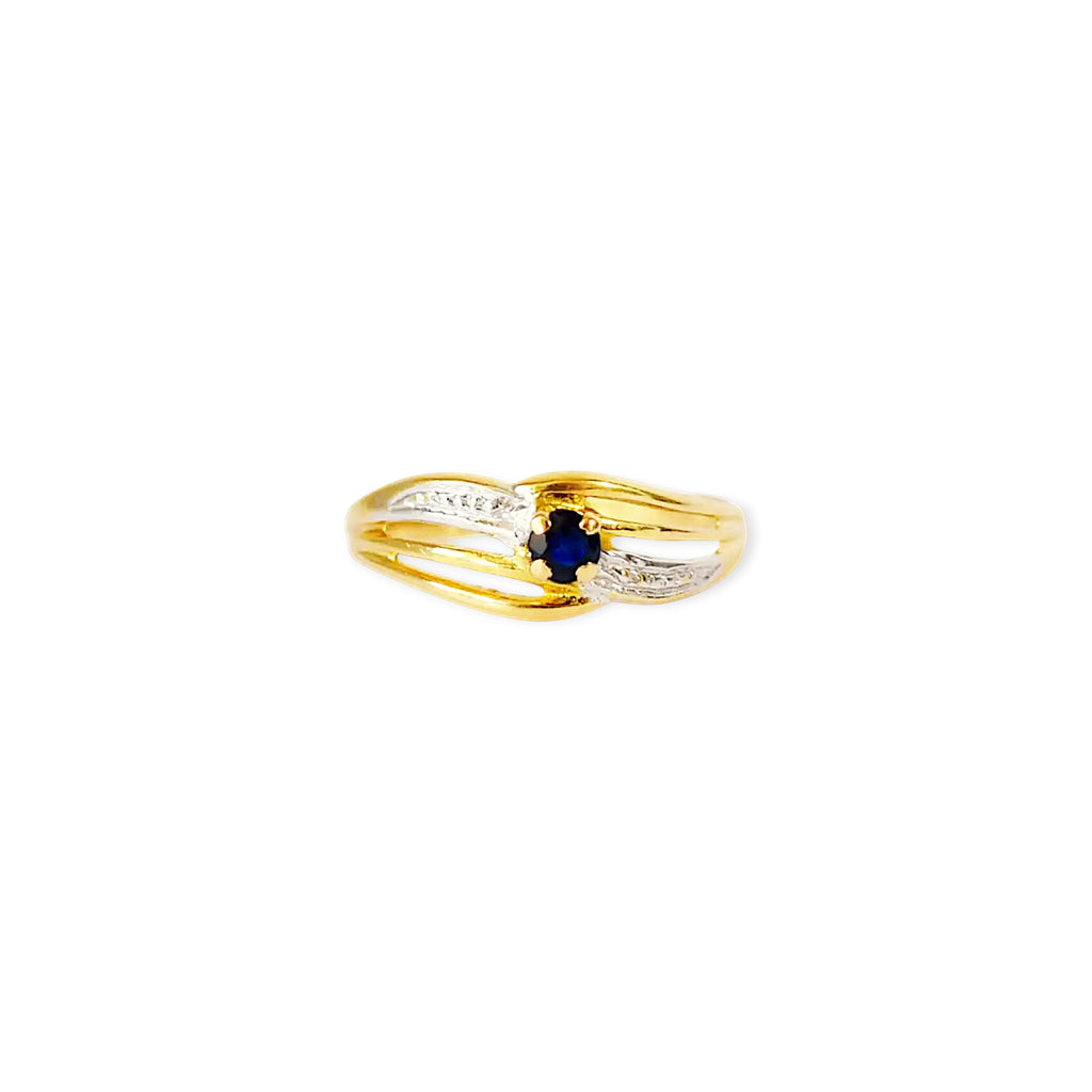 Elegant 18 Karat Yellow Gold ring featuring an oval blue sapphire.