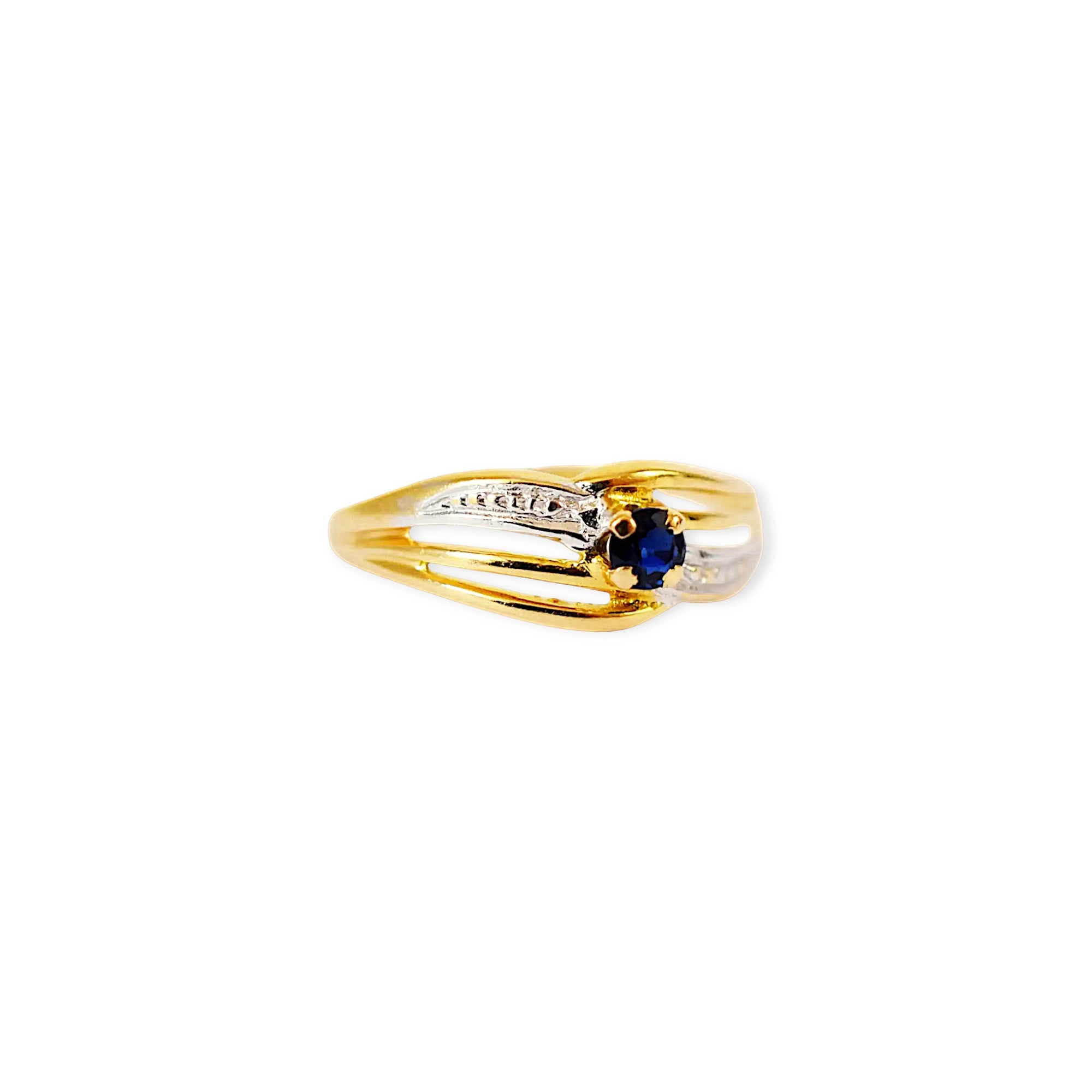 Elegant 18 Karat Yellow Gold ring featuring an oval blue sapphire.