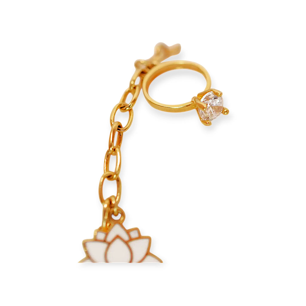Elegant 21 Karat Yellow Gold double-chain charm bracelet, adorned with four diverse symbolic charms including a white lotus flower, a blue evil eye, and a miniature solitaire ring.