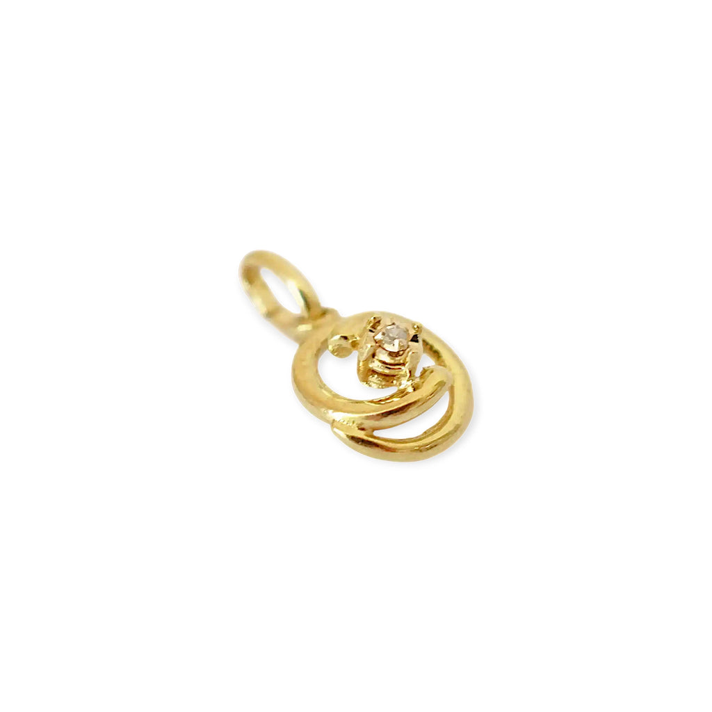 Elegant 8 Karat Yellow Gold pendant featuring a natural diamond nestled within a captivating spiral design