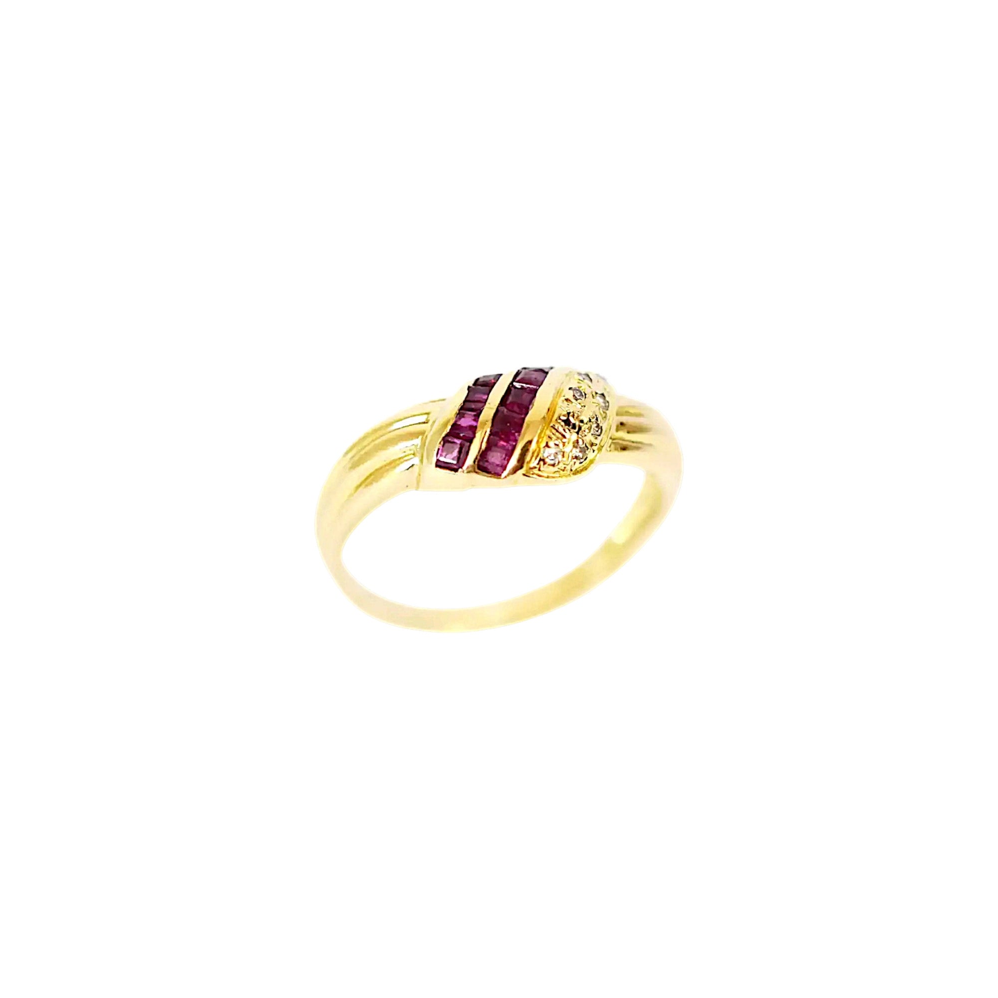 Elegant 18 Karat Yellow Gold Ring in a crossover design with channel-set baguette rubies and pavé-set diamonds.