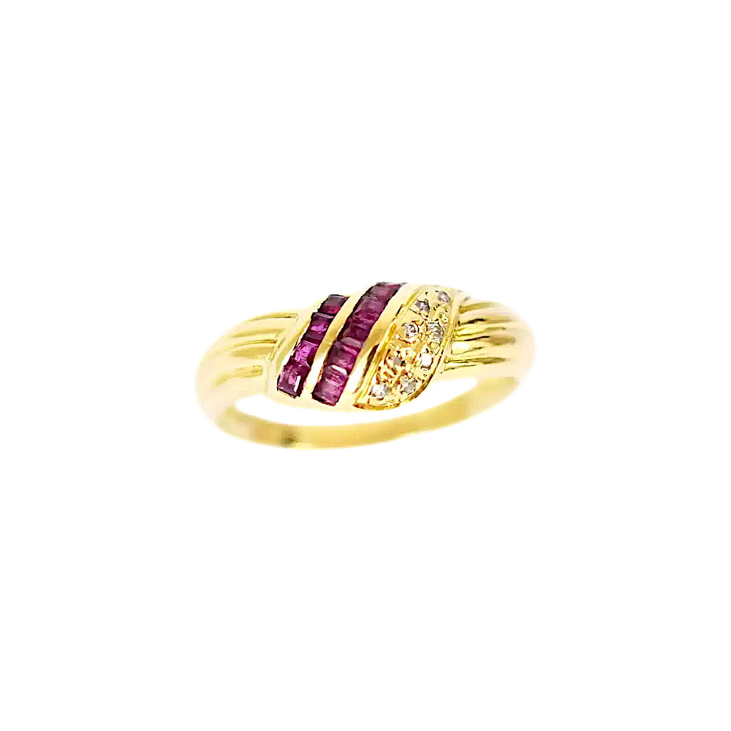 Elegant 18 Karat Yellow Gold Ring in a crossover design with channel-set baguette rubies and pavé-set diamonds.