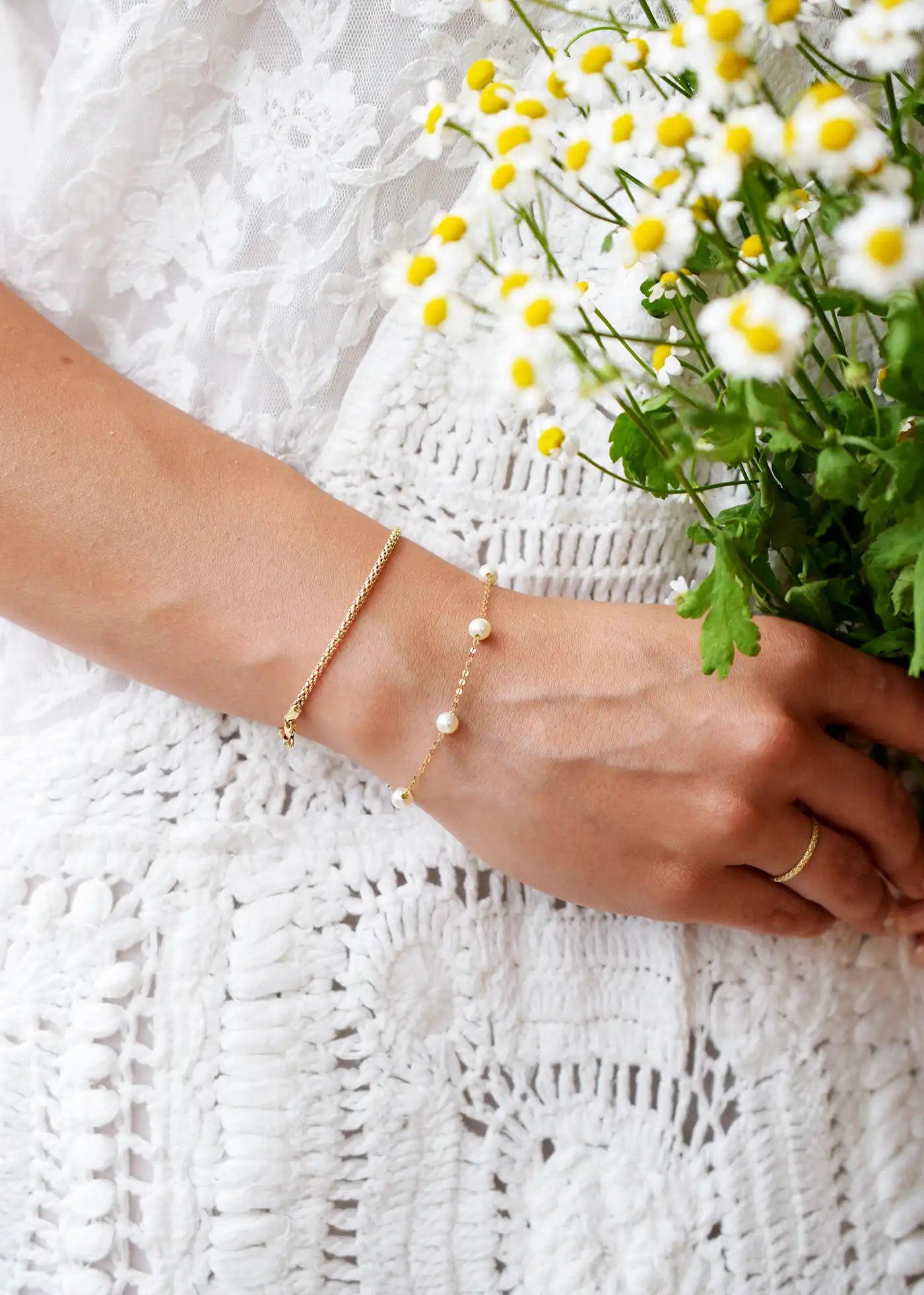 Romantic 18 Karat Yellow Gold bracelet showcasing glowing freshwater pearls along a delicate link chain.